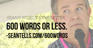600 words or less typeset over a faded picture of sean buvala at a microphone